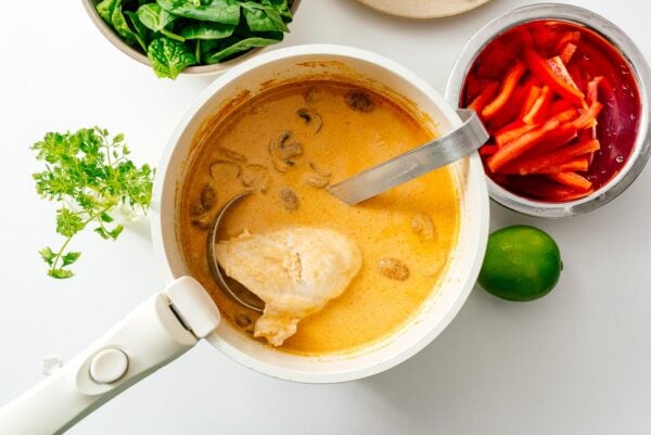Making the soup for Thai red curry ramen | www.iamafoodblog.com