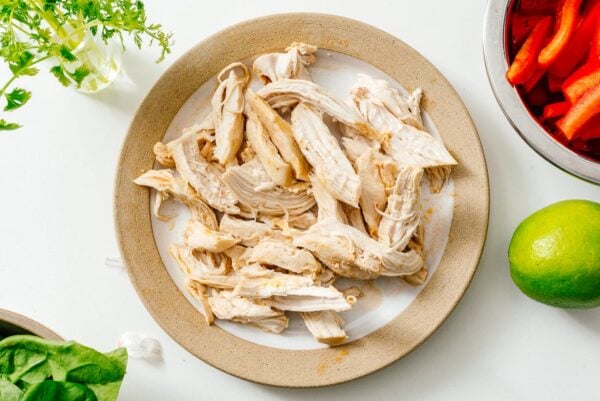Shredding chicken for Thai red curry ramen | www.iamafoodblog.com