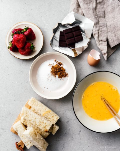 This is going to be the best French toast you’ll ever eat! Cure your churro and French toast cravings with these golden brown crispy French toast sticks dipped in cinnamon and sugar. Dark chocolate dipping sauce not optional! #breakfast #brunch #recipes #frenchtoast #churros #cinnamonsugar #frenchtoaststicks