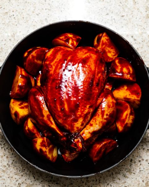 This 6 ingredient sheet pan dinner is your next weeknight rockstar: slightly spicy, slightly sweet Korean inspired chicken with creamy crispy roast potatoes #roastchicken #chicken #recipes #recipe #dinner #easy