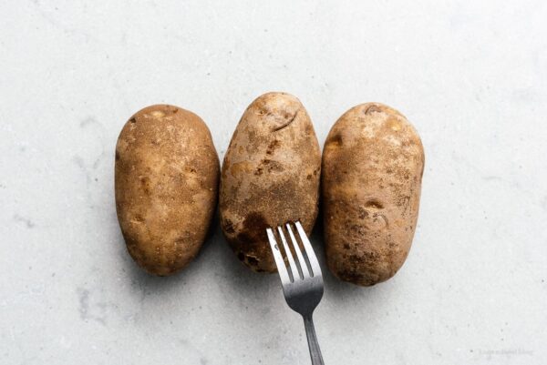 poking potatoes with a fork | www.iamafoodblog.com