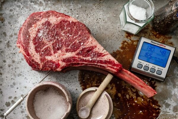 tomahawk steak with a meat thermometer inserted | www.iamafoodblog.com