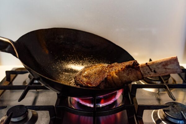searing a tomahawk steak with a wok | www.iamafoodblog.com