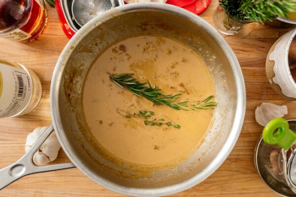 Making au poivre sauce with thyme and rosemary | www.iamafoodblog.com